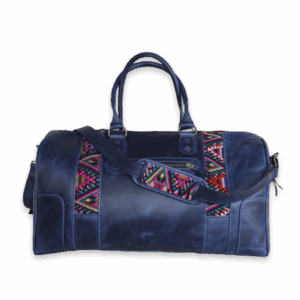 ITZANAMI, a handcrafted leather shoulder bag, with a huipil